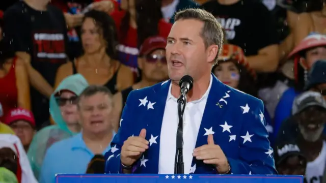 Waltz seen speaking at a Trump rally in 2021