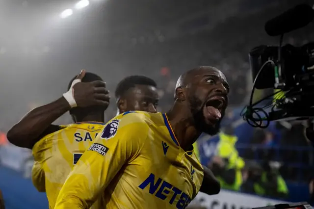 Jean-Philippe Mateta pulls a wild face for the TV cameras as Crystal Palace players celebrate