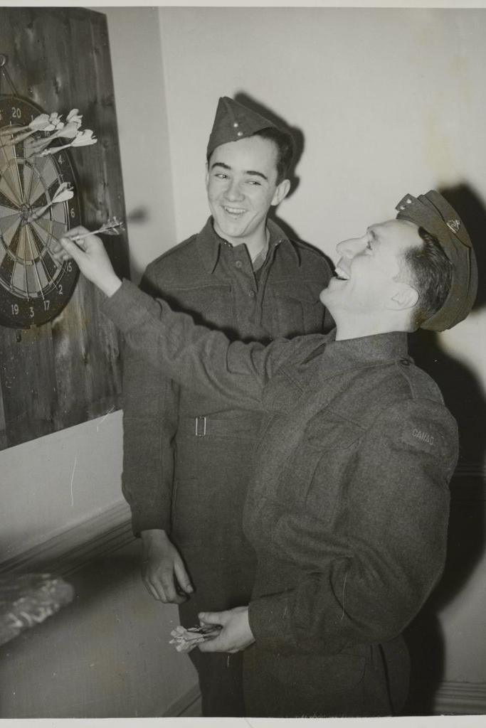 Two Canadians at a darts board at the Beaver Club