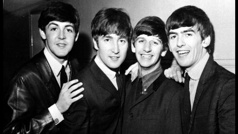  Paul McCartney, John Lennon, Ringo Starr and George Harrison. The photo is in black and white