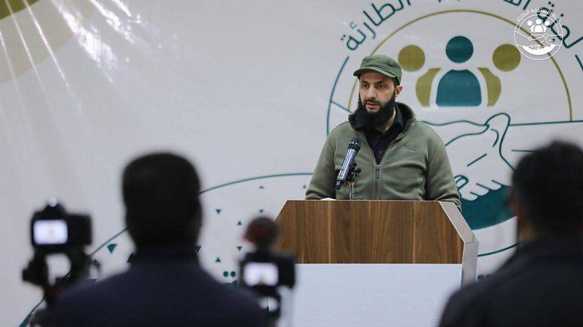 Abu Mohammed al-Jolani taking questions at a press conference following the February 2023 earthquakes in northern Syria