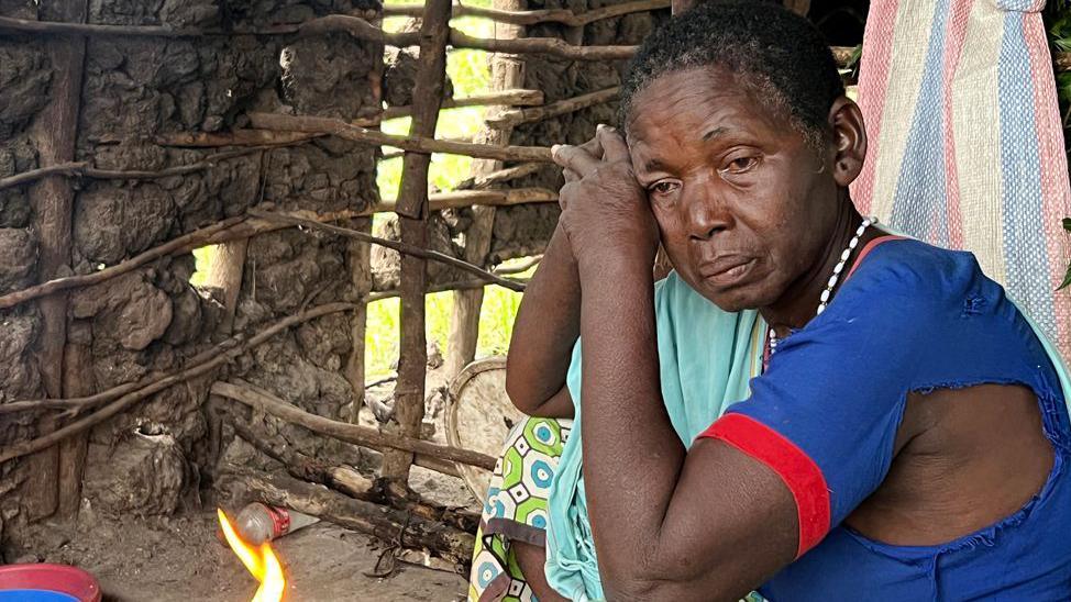 A woman resting her head on her hands