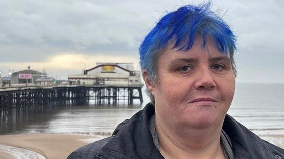 Eve at Blackpool beach with the pier behind her