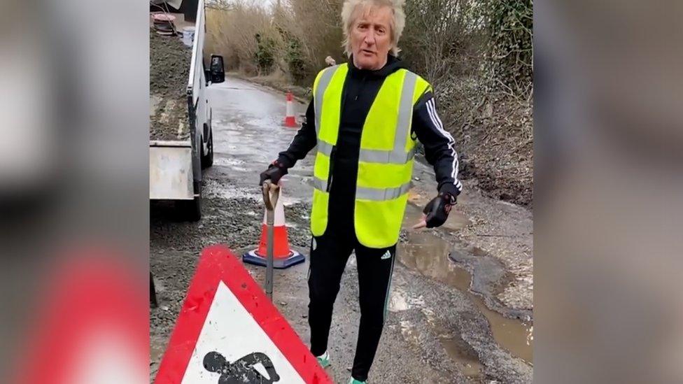 Sir Rod Stewart fixing potholes.