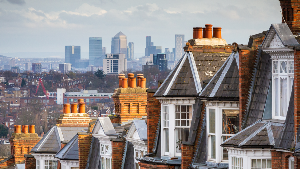 Row of housing from north London - overlooking Canary Wharf and city