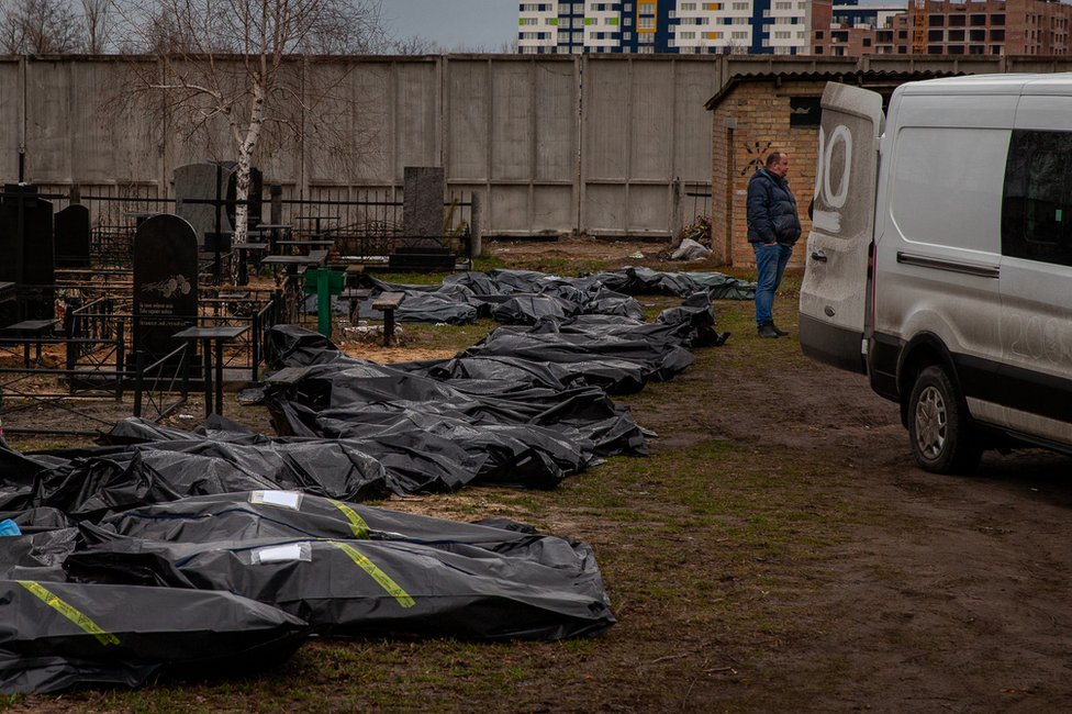 The line of body bags at the Bucha cemetery, waiting to be processed and buried.