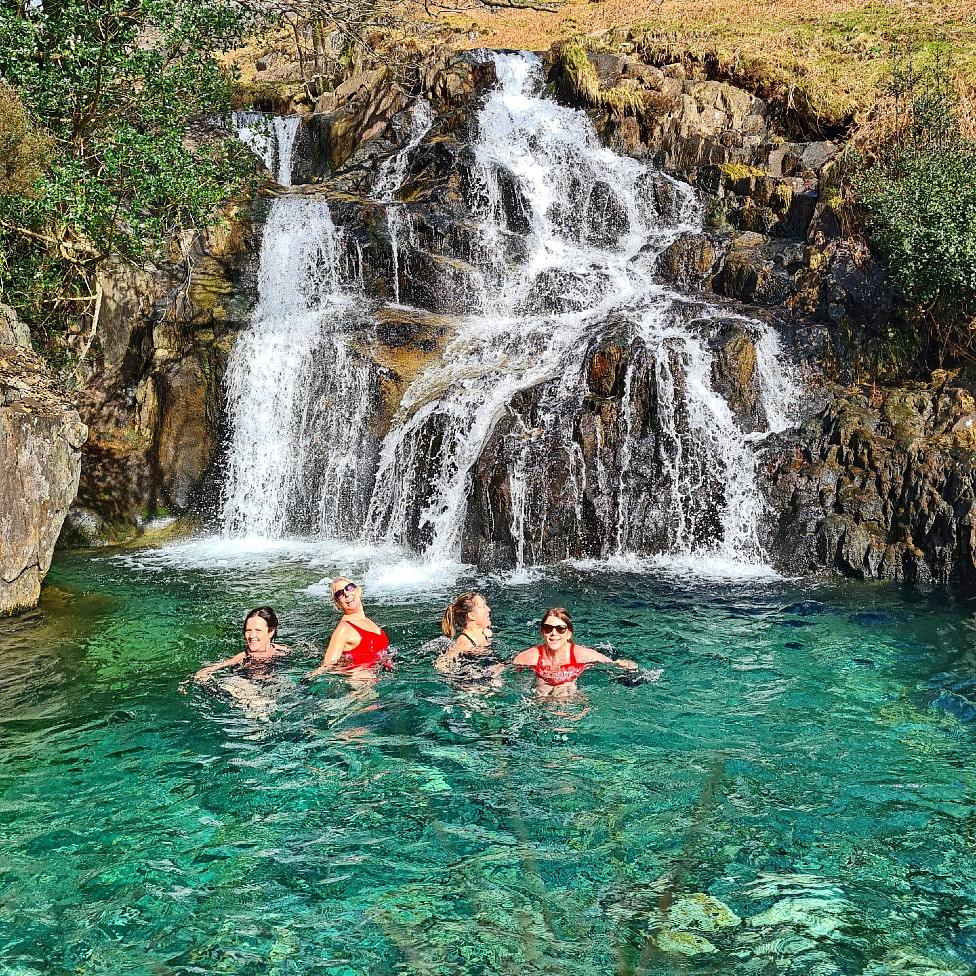 Four women in a mountain pool