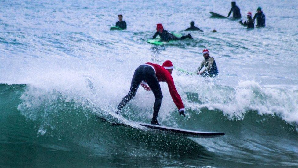 Santa surfs