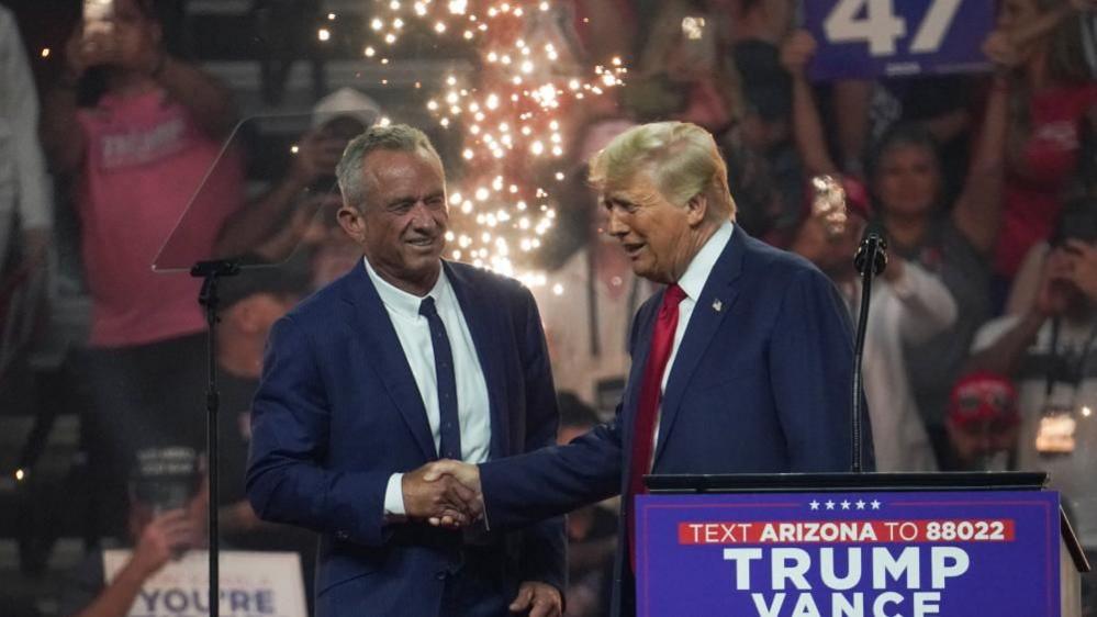 Donald Trump shakes hands with RFK in Glendale, Arizona, on 23 August 2024