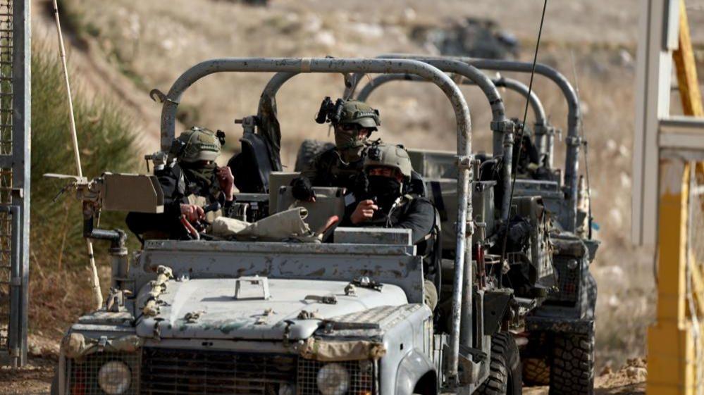 isralei troops in a jeep