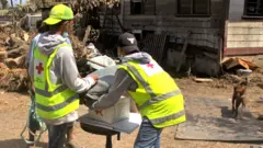 An undated handout photo made available by Tonga Red Cross Society (TRCS) shows Red Cross teams delivering essential relief items in Kanokupolu, western Tongatapu, Tonga (issued 24 January 2022)