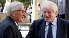 Jean Claude Juncker e Boris Johnson