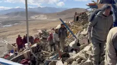 Rescue teams work amidst rubble in the aftermath of an earthquake in a location given as Shigatse City, Tibet Autonomous Region, China, in this screengrab obtained from a handout video released on January 7, 2025.