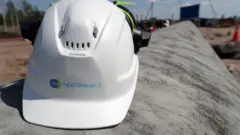 A construction helmet on a section of the Nord Stream 2 natural gas pipeline near Kingisepp, Leningrad Region, Russia, 5 June 2019