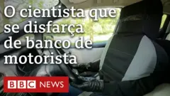 homem disfarçado em banco de motorista