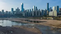 An aerial shot taken with a drone shows the dried out riverbed of the Jialing River, a major tributary of the Yangtze River, in Chongqing, China, 21 August 2022