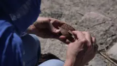 Cecile Michel writing an Old Assyrian woman's letter