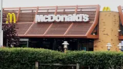 A front-on view of the McDonald's logo and sign at the branch in Caxton in Cambridgeshire taken on 19 July