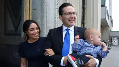 Canadian Conservative Party leader Pierre Poilievre, wife Anaida and son Cruz arrive at the National Conservative caucus meeting on September 12, 2022 in Ottawa.