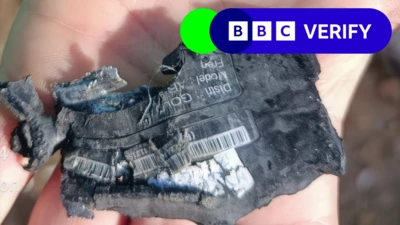 Close up image of fragments of an exploded pager in Lebanon on 18 September, with the BBC Verify branding in the top right corner of the image