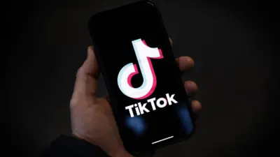 TikTok logo on smartphone screen