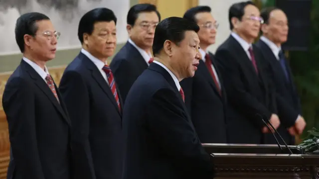 Chinese Vice President Xi Jinping (Front), one of the members of new seven-seat Politburo Standing Committee, delivers a speech as (L-R) Zhang Gaoli, Liu Yunshan, Zhang Dejiang, Li Keqiang, Yu Zhengsheng and Wang Qishan standing at the Great Hall of the People on November 15, 2012 in Beijing,