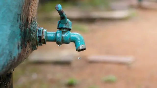 A water tap with a water drop