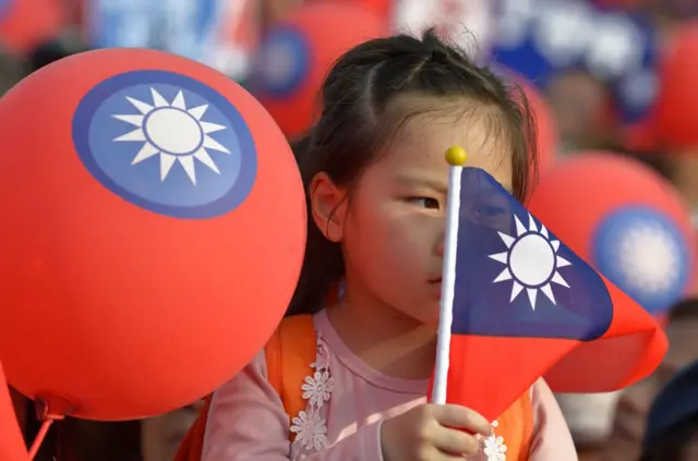 A young supporter of mayoral candidate Ting Shou-chung from the opposition Kuomintang party attend a campaign rally in Taipei on November 11, 2018. - The island-wide vote on November 24 is seen as a crucial barometer for Taiwan's President Tsai Ing-wen as she battles against a backlash on domestic reforms and concerns over relations with China, which have become increasingly tense since she took office in 2016. (Photo by Chris STOWERS / AFP) (Photo credit should read CHRIS STOWERS/AFP/Getty Images)