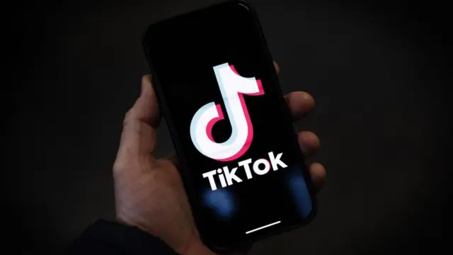 TikTok logo on smartphone screen