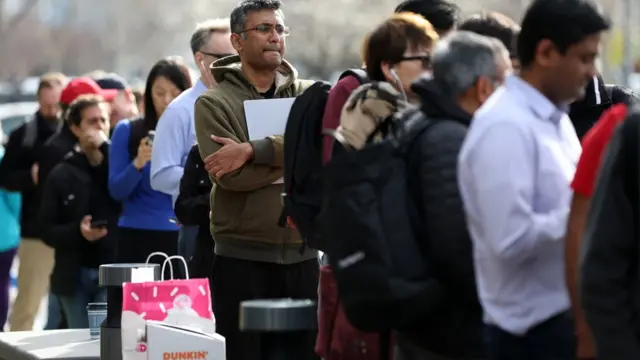 Queue of people outside SVB bank branch in California