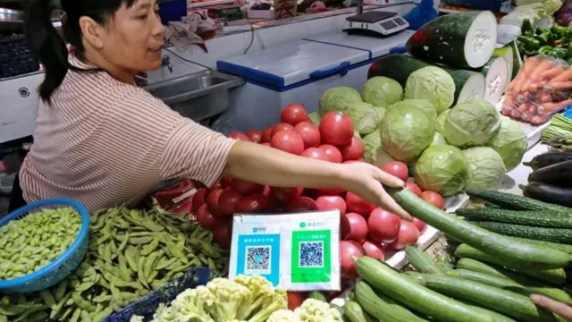 Barraca de alimentos com QR do WeChat