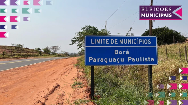 Placa em estrada diz: Limite de municípios - Borá / Paraguaçu Paulista