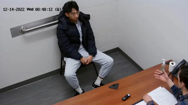 Xiaolei Wu, a citizen of China who at the time was a student at the Berklee College of Music in Boston, sits for an interview with the Federal Bureau of Investigation at its office in Chelsea, Massachusetts, December 14, 2022 in a still image from video. U.S. Attorney’s Office for the District of Massachusetts/Handout via REUTERS.