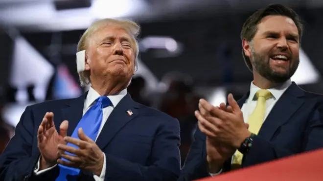 Republican presidential nominee and former U.S. President Donald Trump and Republican vice presidential nominee J.D. Vance applaud on Day 2 of the Republican National Convention (RNC), at the Fiserv Forum in Milwaukee, Wisconsin, U.S., July 16, 2024. REUTERS/Callaghan O'hare/File Photo