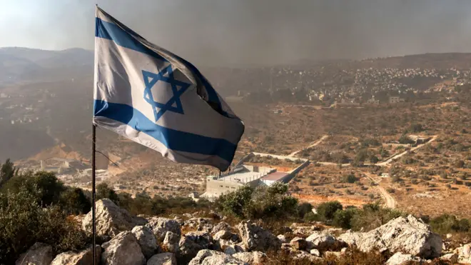 An Israeli flag in the settler outpost of Eviatar, on June 21, 2021