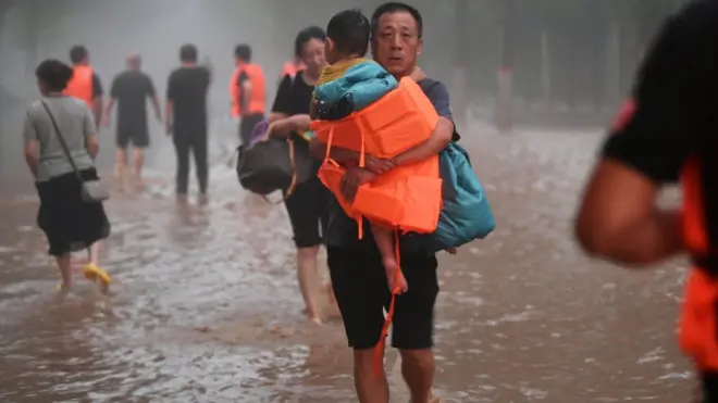 Trapped people are evacuated at flood-hit Tazhao village on August 1, 2023 in Zhuozhou, Hebei Province of China. Rescue and relief efforts were underway after heavy rains triggered floods in Zhuozhou