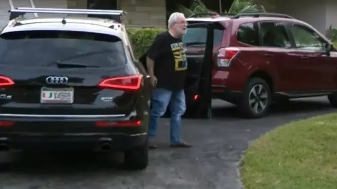 University of Miami professor Bruce Bagley was door stepped by reporters at his home