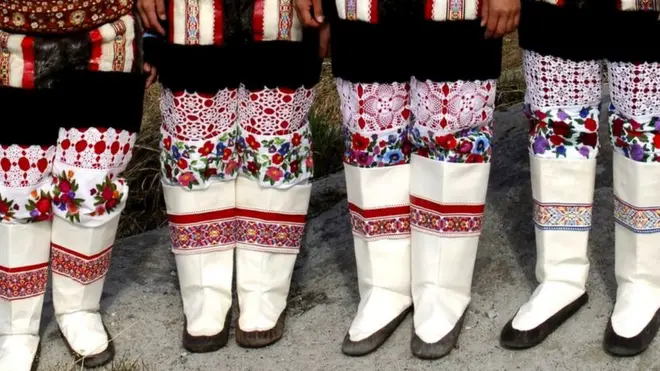 Inuit women wearing traditional clothing in Ilulissat, Greenland.