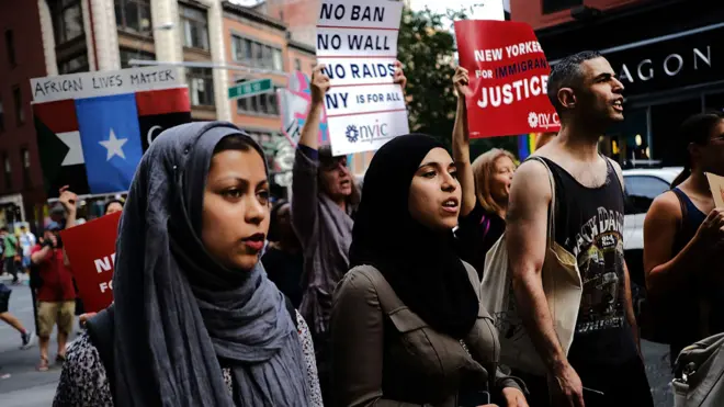 Travel ban protests took place in New York as the ban took effect