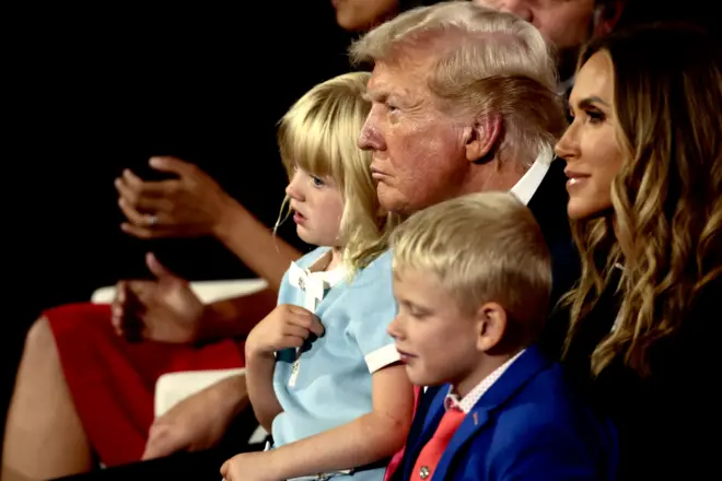 Former US President Donald Trump, center, with his grandchildren during the Republican National Convention (RNC) at the Fiserv Forum in Milwaukee, Wisconsin, US, on Thursday, July 18, 2024. The RNC chairman warned against complacency when his party concludes its official nominating jamboree this week with polls predicting ex-President Donald Trump prevailing over President Joe Biden in the November election. 