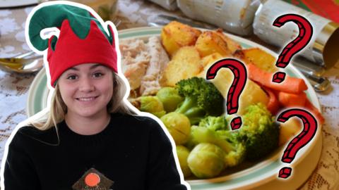 Matilda Ramsay wearing an elf hat, against a background photo of a selection of Christmas presents.