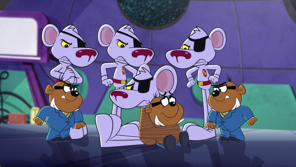 Three Danger Mouse's and two Penfold's look angry at each other while the original Danger Mouse and Penfold are tied up in between everyone.