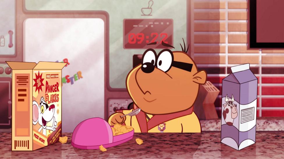 A cartoon hamster looks puzzled as he eats cereal out of a pink slipper (Penfold from Danger Mouse).