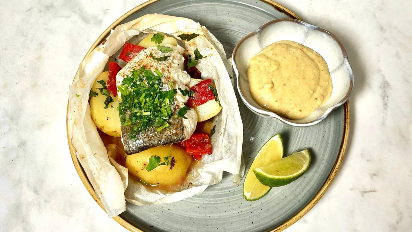 Baked hake with roasted red peppers and potatoes