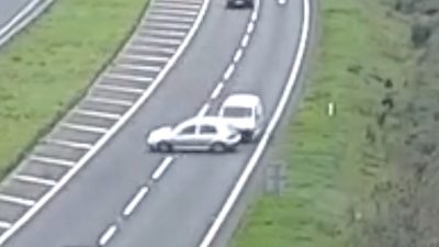 A white van ramming into the side of a car on a dual carriageway