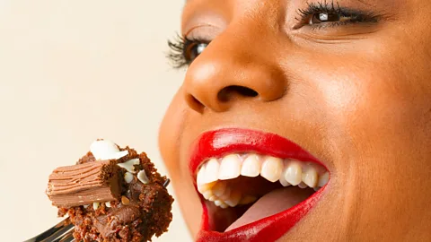 A woman eating cake