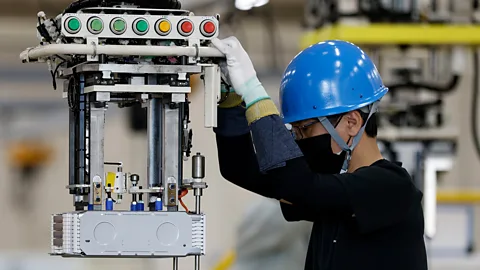 A man working on lithium battery production at a factory in China (Credit: Getty Images)