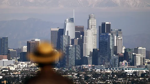 The skyline of downtown Los Angeles with mountains behind (Credit: Getty Images)