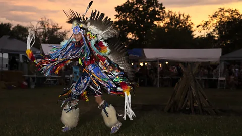 Person performing a traditional dance at a Native American powwow at Queens Farm Museum (Credit: Getty Images)