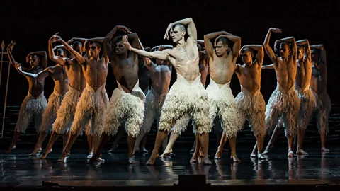 Matthew Bourne with Culture Shifter illustration behind him (Credit: Emmanuel Lafont/Getty Images)